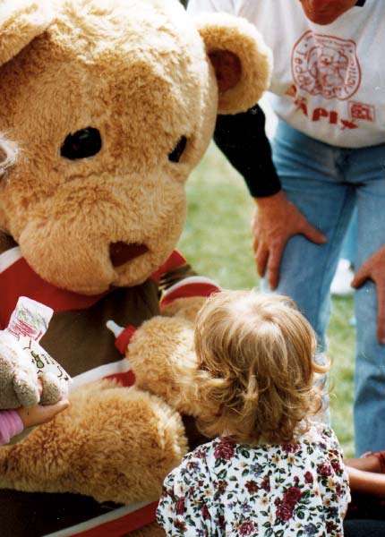 Bromley takes a drink at the teddy bears picnic